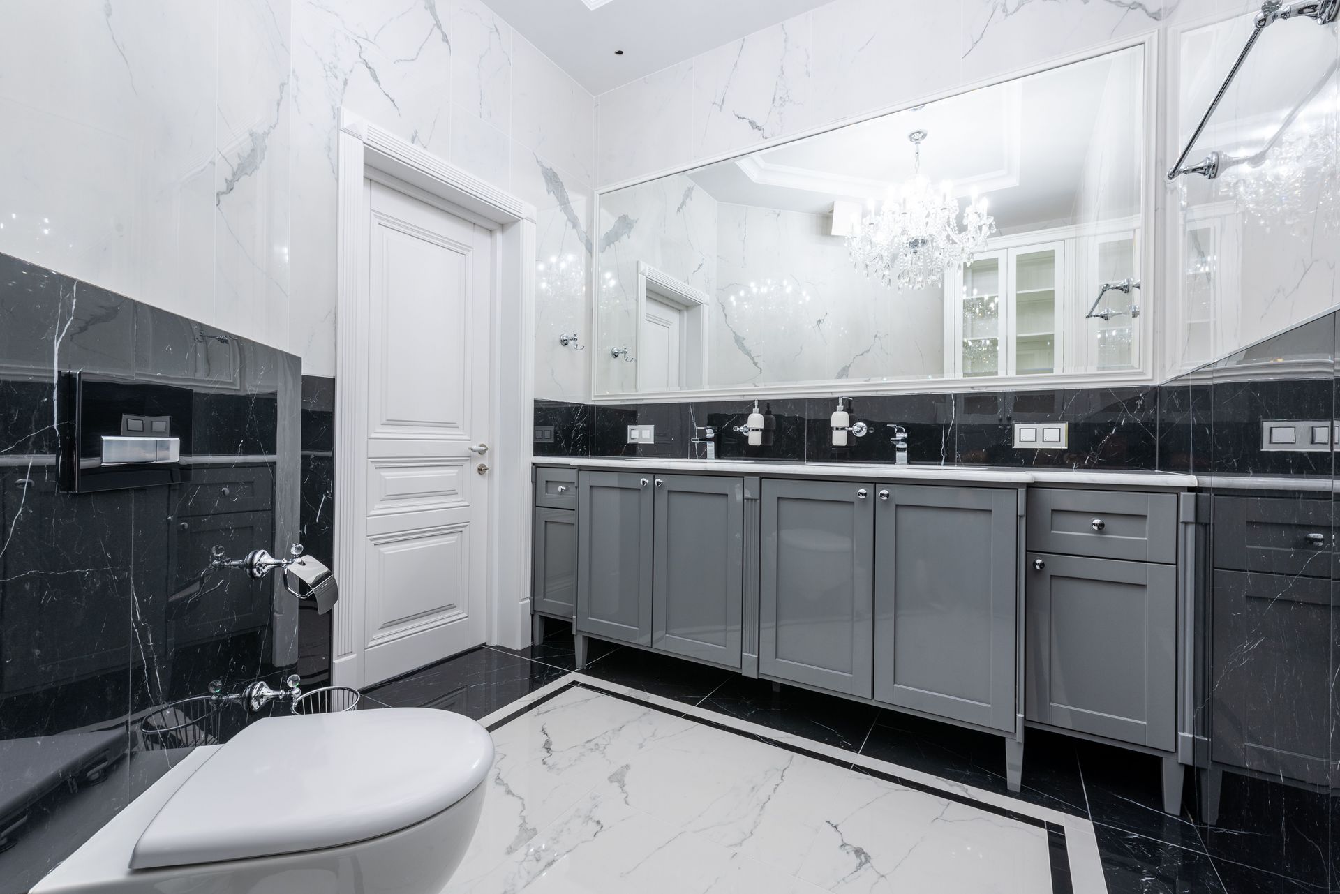 Interior of modern bathroom with toilet and double sink illuminated with bright light of lamps